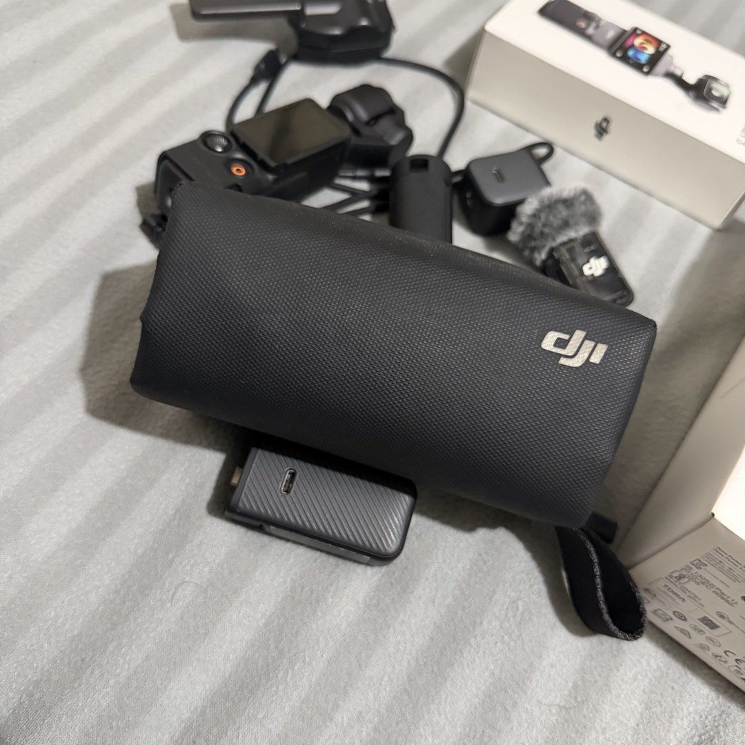 DJI Osmo Pocket 3 Creator Combo (Category: Cameras) located in Pasay City. Submitted by datimataba (Listing ID 1452423563, Image 3). Description: - DJI Osmo Pocket 3 Creator Combo - Complete vlogging and content creation package - Includes: Camera, Microphone, Tripod, Battery Handle, Bag - Compact and user-friendly design - Ideal for travel and on-the-go filming -Good As new, replaced unit kaya may isa pang box. Since replacement di na siya nagag
