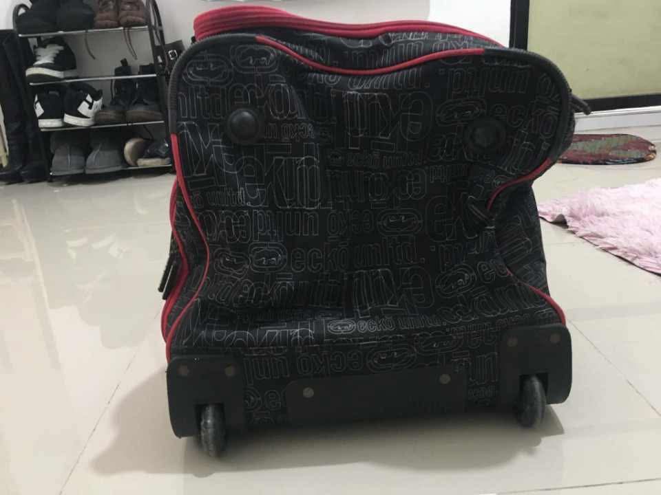 Ecko Unltd. Black & Red luggage bag (Category: Luxury Bags & Wallets) located in Caloocan City. Submitted by remythrift (Listing ID 1452498379, Image 3). Description: - Brand: Ecko Unltd. - Color: Black with red accents - Design: All-over Ecko print - Features: Wheels and retractable handle for easy transport - Capacity: Plenty of space for gear - Ideal for: Travel, sports, gym.