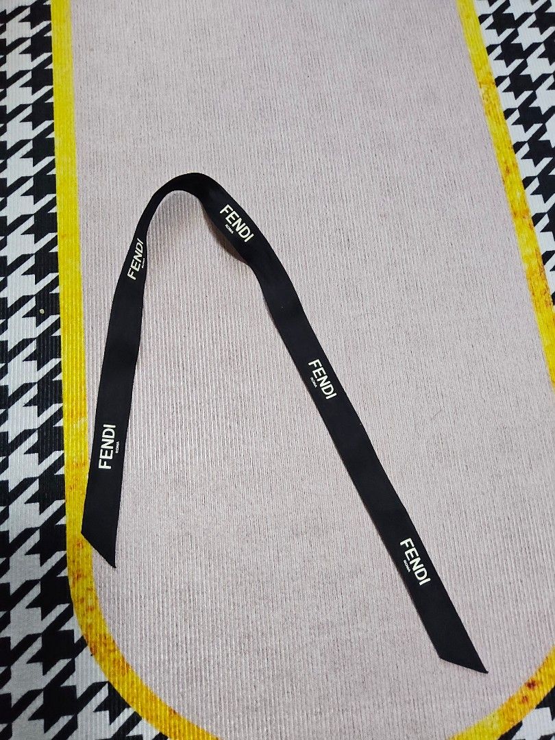 Fendi Roma Ribbon Black (Category: Luxury Bags & Wallets) located in Alaminos. Submitted by shee09 (Listing ID 1452403709, Image 1). Description: - Authentic Fendi ribbon - Black with repeating white Fendi Roma logo - Approximately 60cm in length - Ideal for gift wrapping or DIY projects.