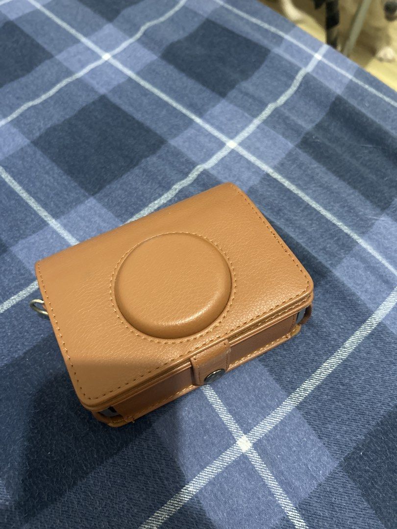 Fujifilm Instax Mini Evo Leather Camera Case (Category: Cameras) located in Manila. Submitted by calmmoon_0f900a (Listing ID 1452448975, Image 3). Description: - Genuine brown leather case for Fujifilm Instax Mini Evo. - Provides excellent protection against scratches. - Features a detachable front cover for easy shooting. - Snugly fits your camera for a secure feel. - Ideal for taking your Instax Mini Evo anywhere. .