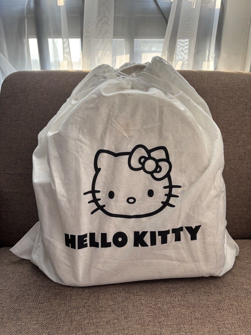 Hello Kitty Beige Monogram Backpack (Category: Backpacks) located in Mexico. Submitted by 3everything (Listing ID 1452421176, Image 3). Description: - Adorable beige backpack featuring an all-over Kitty and bow print. - Convenient front zip pocket for easy access to essentials. - Adjustable straps for a comfortable, customized fit. - Comes with a complimentary Kitty dust bag and box - Ideal for everyday adventures or your next getaway..