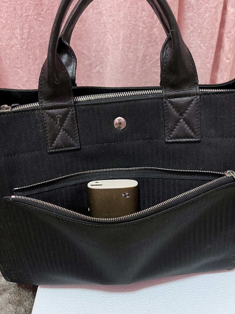 Hermes canvas laptop document handcarry black tote (Category: Tote Bags) located in Johor Bahru. Submitted by kembangputih (Listing ID 1452448908, Image 2). Description: Vintage bag only handcarry Heavy duty canvas Can fit laptop n A4 documents Tapak 40x11x27cm Free jnt No returns Bank trf only .