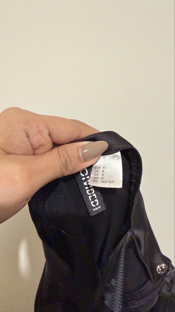 H&M Divided Black Satin Midi Skirt (Category: Skirts) located in Pasig City. Submitted by pat.closetcleanup (Listing ID 1452457426, Image 3). Description: - H&M Divided black satin midi skirt - With side zipper - Versatile for dressing up or down.