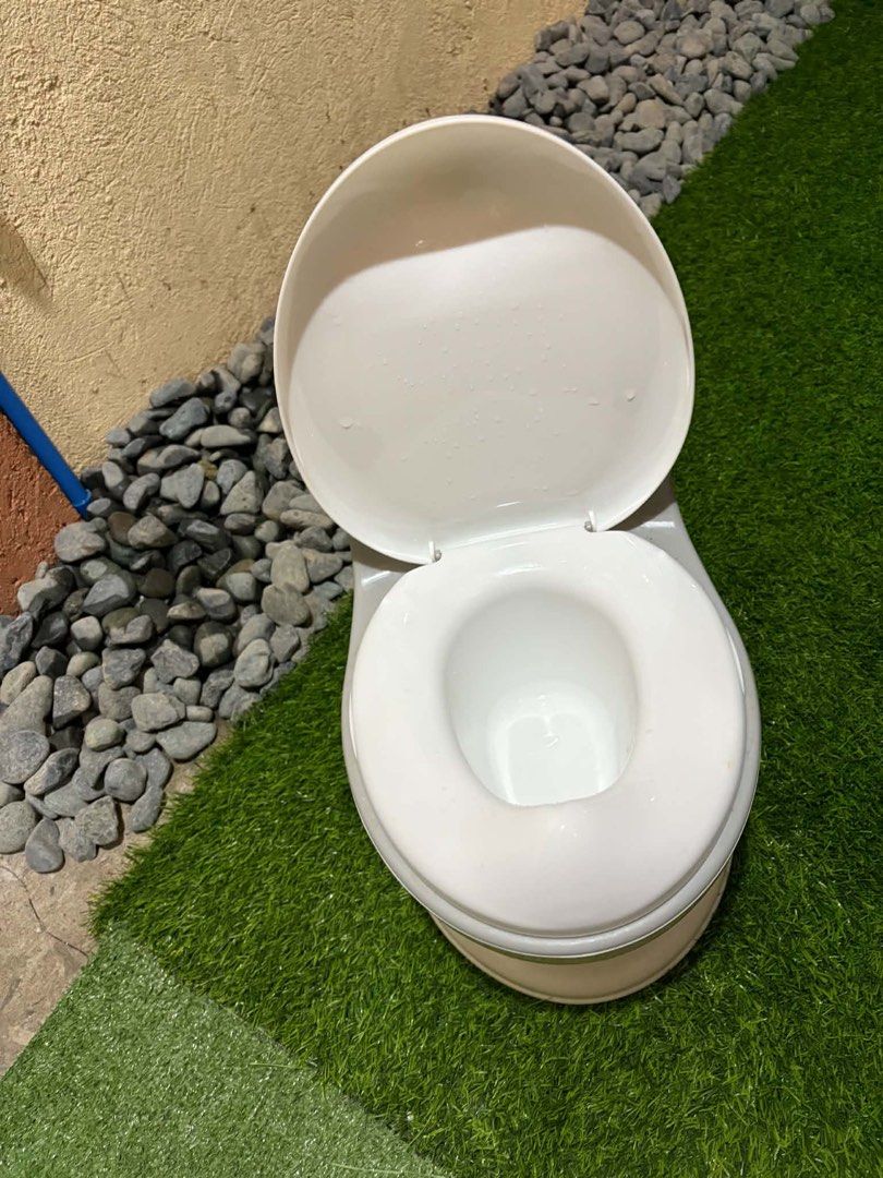 Ifam Potty Training Toilet Seat (Category: Toilet Training) located in Quezon City. Submitted by mnikavllnv (Listing ID 1452467342, Image 2). Description: - White potty training toilet seat - Features a grey accent band - Designed to mimic a real toilet for easier transition - Easy to clean and maintain - Perfect for potty training your little one - Ready for its next user! Location: Sumulong Antipolo.