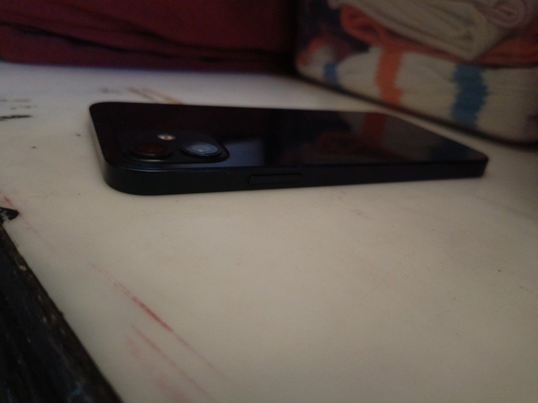 iPhone 12 Openline RUSH (Category: iPhone 12 Series) located in Caloocan City. Submitted by sneak-mark (Listing ID 1452367764, Image 3). Description: iPhone 12 64GB Black (Openline) (Unit and charger but no brick) Condition: All working (Face ID & True Tone OK), no history of repair. Minimal Issues: Battery Health: 78% (Service) Minor scratches/dents (normal wear) Meetup: Caloocan / Monumento / SM Grand Central.