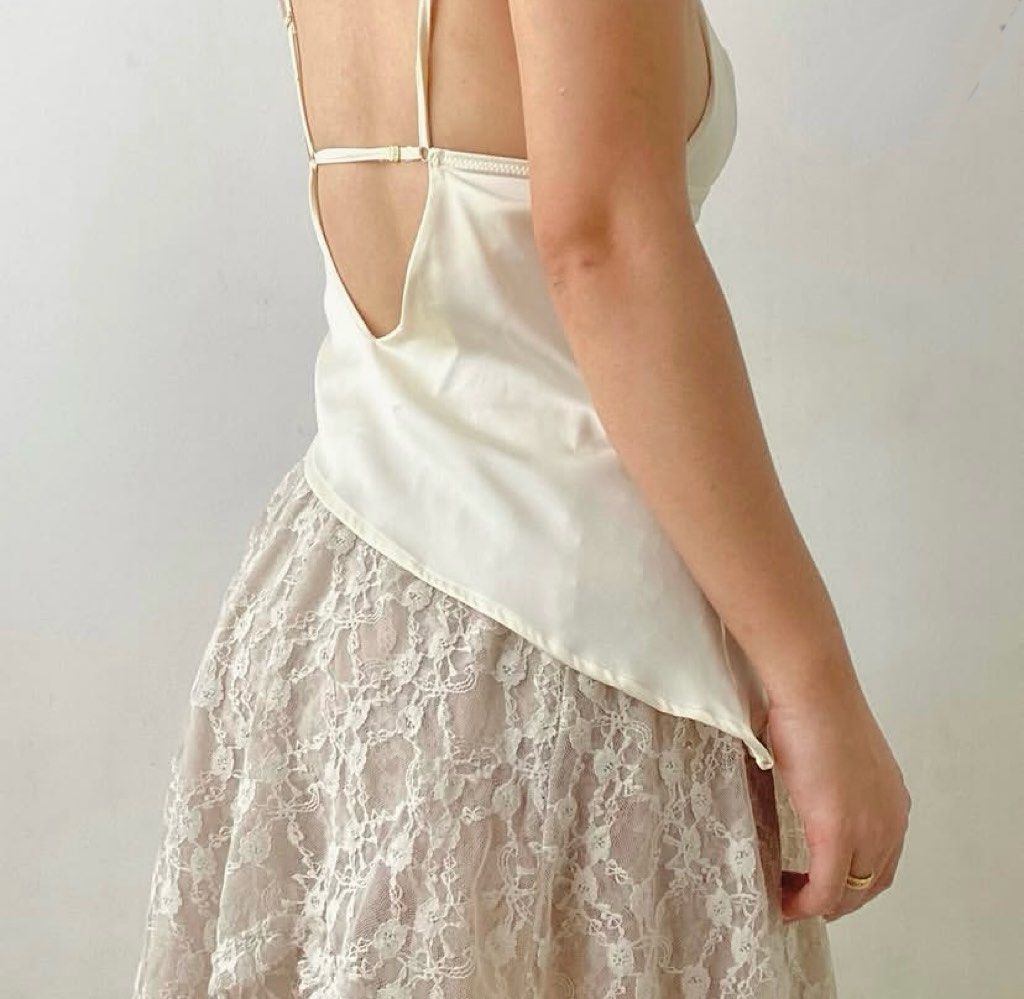 Ivory satin asymmetrical milkmaid bustier top (Category: Sleeveless) located in Davao. Submitted by pastranael72459 (Listing ID 1452504237, Image 2). Description: PM FOR MORE INFOS.