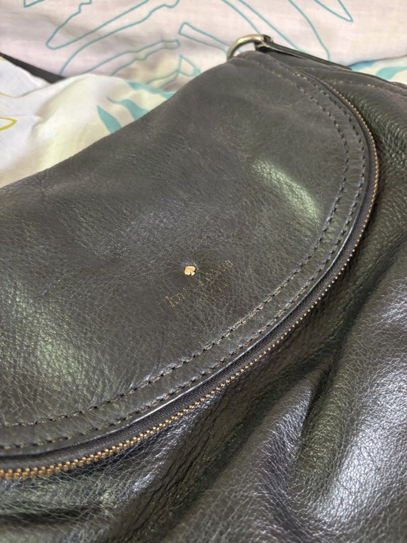 Kate Spade Black Leather Shoulder Bag (Category: Luxury Bags & Wallets) located in Manila. Submitted by danidanidani213 (Listing ID 1452507729, Image 2). Description: - Brand: Kate Spade - Color: Black - Material: Leather - Closure: Zip with flap - Interior: Striped lining, 1 zip pocket - Strap: Chain and leather - Condition: Some signs of wear on leather - Best for: Everyday use.