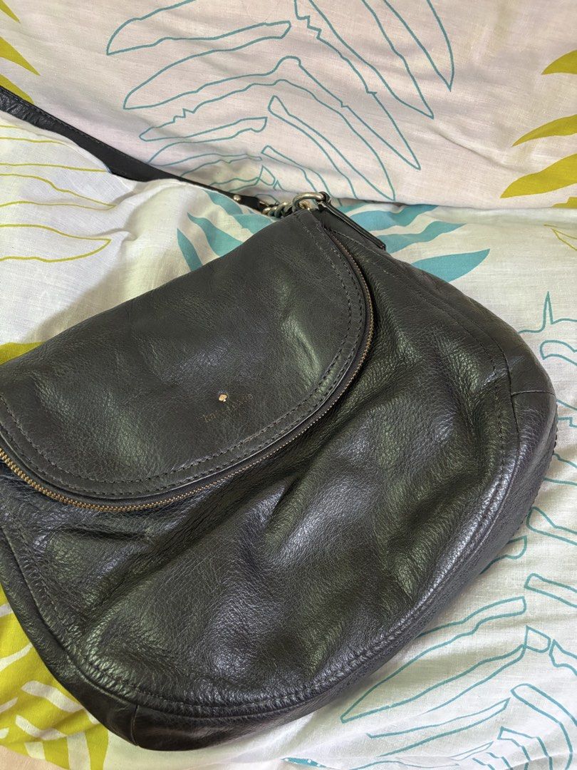 Kate Spade Black Leather Shoulder Bag (Category: Luxury Bags & Wallets) located in Manila. Submitted by danidanidani213 (Listing ID 1452507729, Image 1). Description: - Brand: Kate Spade - Color: Black - Material: Leather - Closure: Zip with flap - Interior: Striped lining, 1 zip pocket - Strap: Chain and leather - Condition: Some signs of wear on leather - Best for: Everyday use.