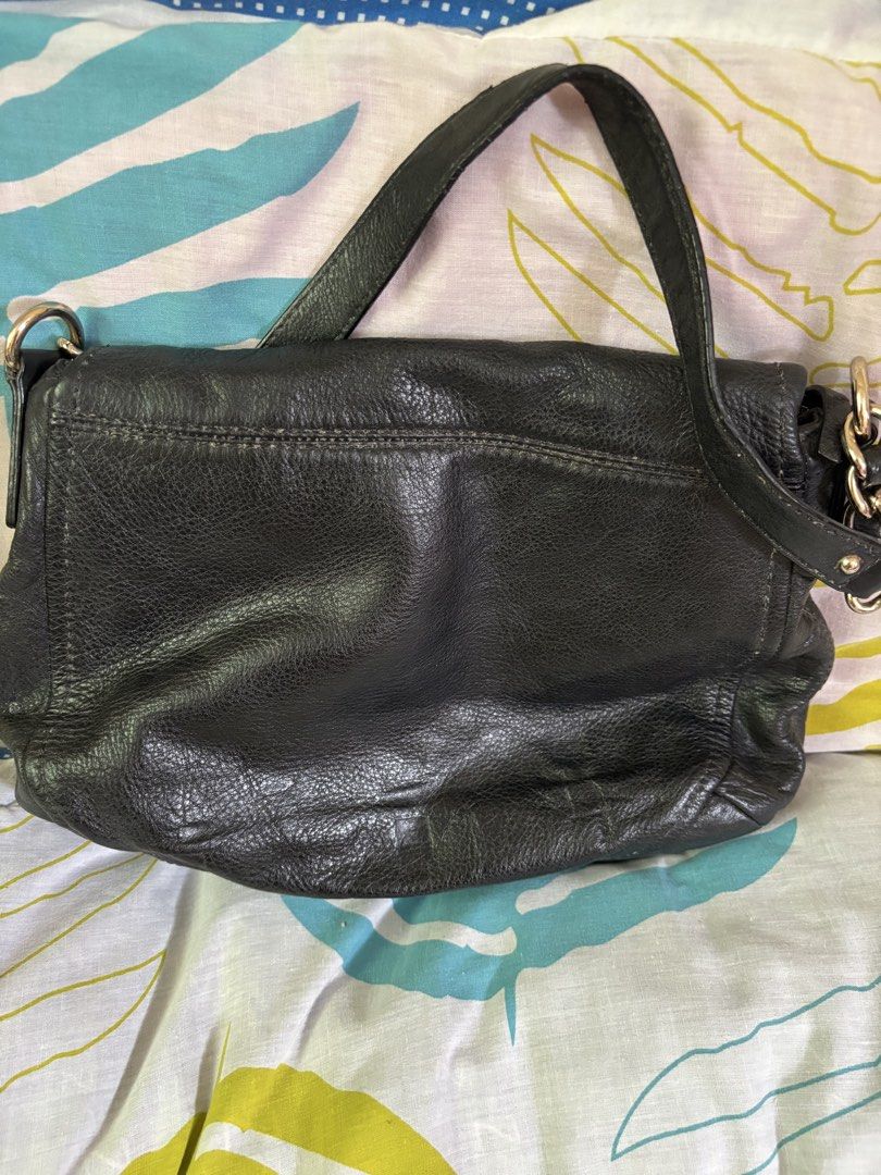 Kate Spade Black Leather Shoulder Bag (Category: Luxury Bags & Wallets) located in Manila. Submitted by danidanidani213 (Listing ID 1452507729, Image 3). Description: - Brand: Kate Spade - Color: Black - Material: Leather - Closure: Zip with flap - Interior: Striped lining, 1 zip pocket - Strap: Chain and leather - Condition: Some signs of wear on leather - Best for: Everyday use.