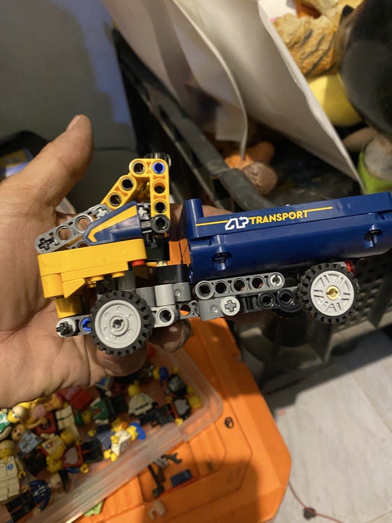 LEGO Technic Transport Truck with Crane (Category: Lego & Building Sets) located in Marikina City. Submitted by jtv17 (Listing ID 1452505493, Image 3). Description: Yellow and blue LEGO Technic truck with a working crane. Features 'CLP TRANSPORT' branding. Perfect for vehicle-building fans!.