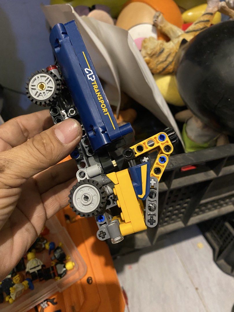 LEGO Technic Transport Truck with Crane (Category: Lego & Building Sets) located in Marikina City. Submitted by jtv17 (Listing ID 1452505493, Image 2). Description: Yellow and blue LEGO Technic truck with a working crane. Features 'CLP TRANSPORT' branding. Perfect for vehicle-building fans!.