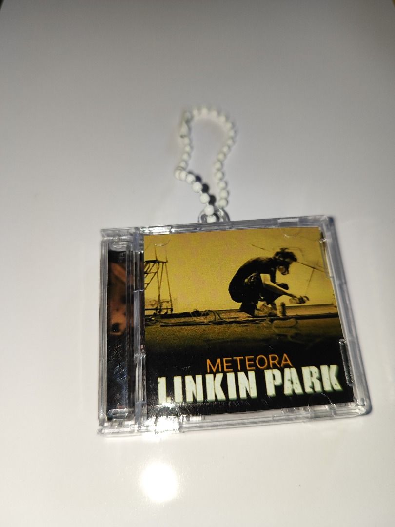 Linkin Park Meteora MINI CD Keychain (Category: CDs & DVDs) located in Santo Domingo. Submitted by nfcminicdkeychainsbytin (Listing ID 1452441012, Image 1). Description: - Linkin Park Meteora CD keychain - Features iconic album cover art - Includes miniature CD and case - Comes with a stylish beaded strap - A must-have collectible for any Linkin Park fan.