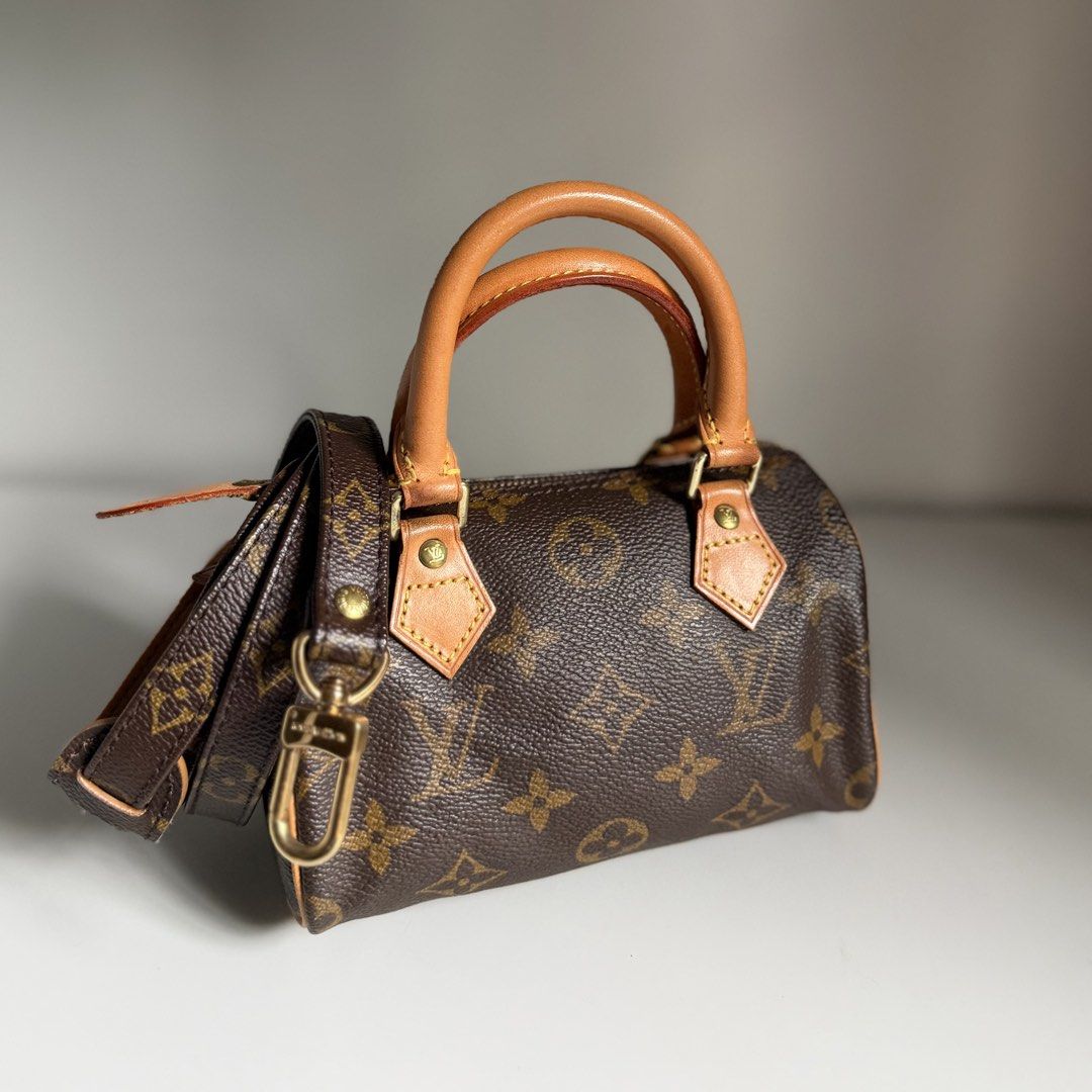 Louis Vuitton Monogram Mini Speedy Bag LV (Category: Luxury Bags & Wallets) located in Quezon City. Submitted by ksumer (Listing ID 1452441269, Image 2). Description: - Classic Louis Vuitton Mini Speedy bag - Monogram canvas with vachetta leather trim and handles - Detachable shoulder strap included - Gold hardware - Secure zipper closure - Compact and perfect for essentials.