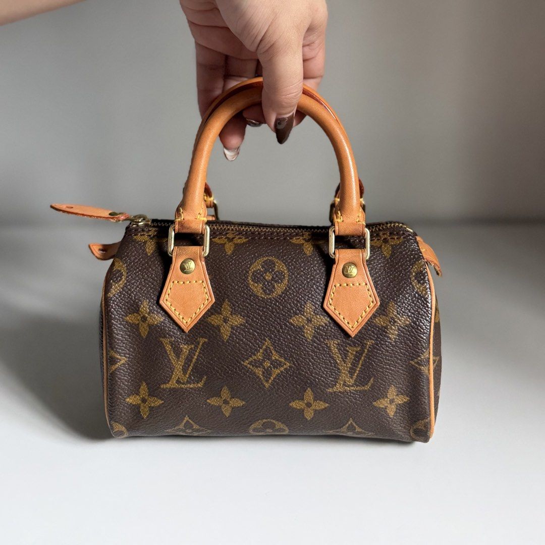 Louis Vuitton Monogram Mini Speedy Bag LV (Category: Luxury Bags & Wallets) located in Quezon City. Submitted by ksumer (Listing ID 1452441269, Image 3). Description: - Classic Louis Vuitton Mini Speedy bag - Monogram canvas with vachetta leather trim and handles - Detachable shoulder strap included - Gold hardware - Secure zipper closure - Compact and perfect for essentials.