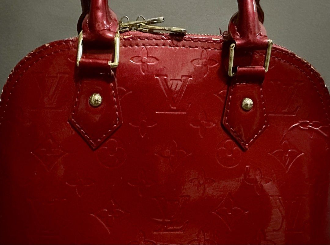 Louis Vuitton Monogram Vernis Alma BB Red (Category: Luxury Bags & Wallets) located in Candaba. Submitted by shokgold19 (Listing ID 1452399515, Image 2). Description: - Classic Red Louis Vuitton Alma BB Bag - Classic Monogram Patent Leather - Gold Hardware and Zipper - Includes Original Lock and Keys - Compact Size, Ideal for Essentials - Minor Scuffs on Bottom Feet and Edges.