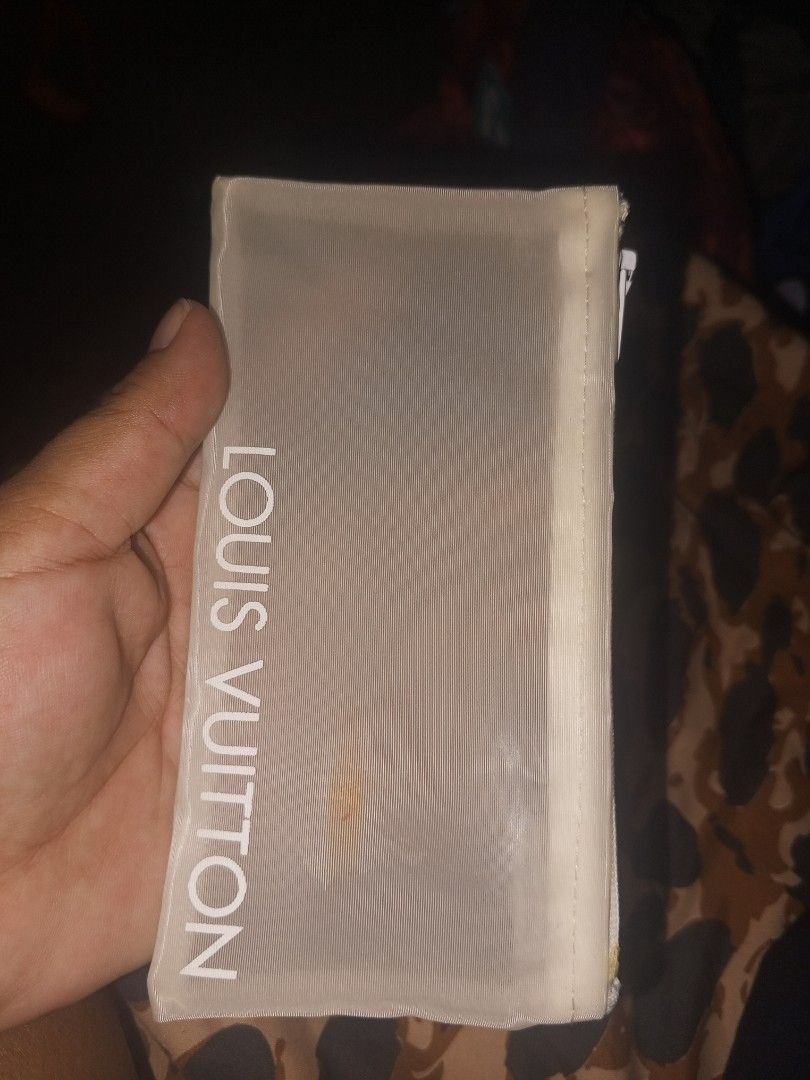 Louis Vuitton Pouch Made in Italy 100% Polyamide (Category: Luxury Bags & Wallets) located in Magalang. Submitted by zeiansoria64090 (Listing ID 1452321957, Image 1). Description: - Authentic Louis Vuitton Pouch - Made in Italy - Material: 100% Polyamide - Translucent design with white Louis Vuitton lettering - Zipper closure - Ideal for organizing small items - Please check photos for detailed condition.