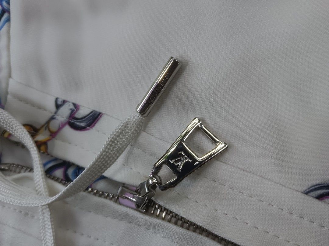 Louis Vuitton White Silk Chain Print Shorts (Category: Shorts) located in Tarlac. Submitted by khrizson16 (Listing ID 1452370046, Image 3). Description: - Authentic Louis Vuitton White Silk Chain Print - Stylish white shorts with a unique blue and gold chain print. - Convenient zip front closure with an adjustable drawstring tie. - Features authentic Louis Vuitton branding on the waistband. - Crafted in Italy for premium quality. - Size: 30.
