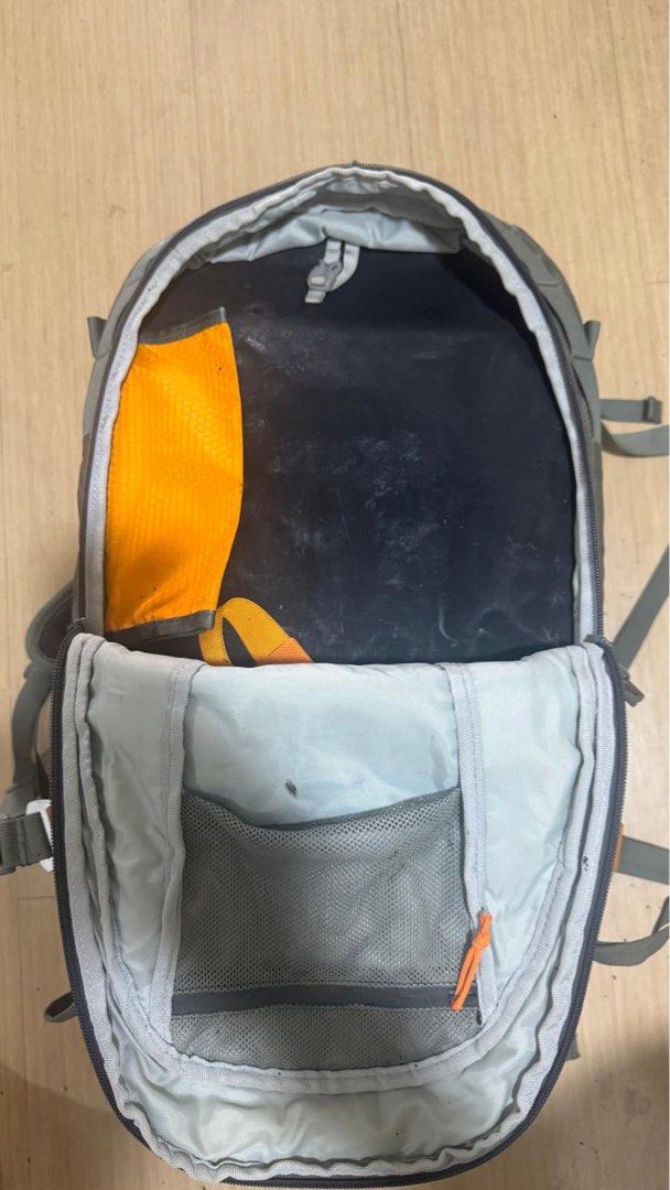 Lowepro Whistler BP 350 AW (Category: Camera Bags & Carriers) located in Mandaluyong City. Submitted by balowee (Listing ID 1452352768, Image 2). Description: - Grey Lowepro backpack - Orange zippers and straps - Multiple internal and external pockets/compartments - Adjustable shoulder straps - Waist strap for added support - Ideal for hiking and travel - Shows some dust and marks from use - Zippers are in good working condition.