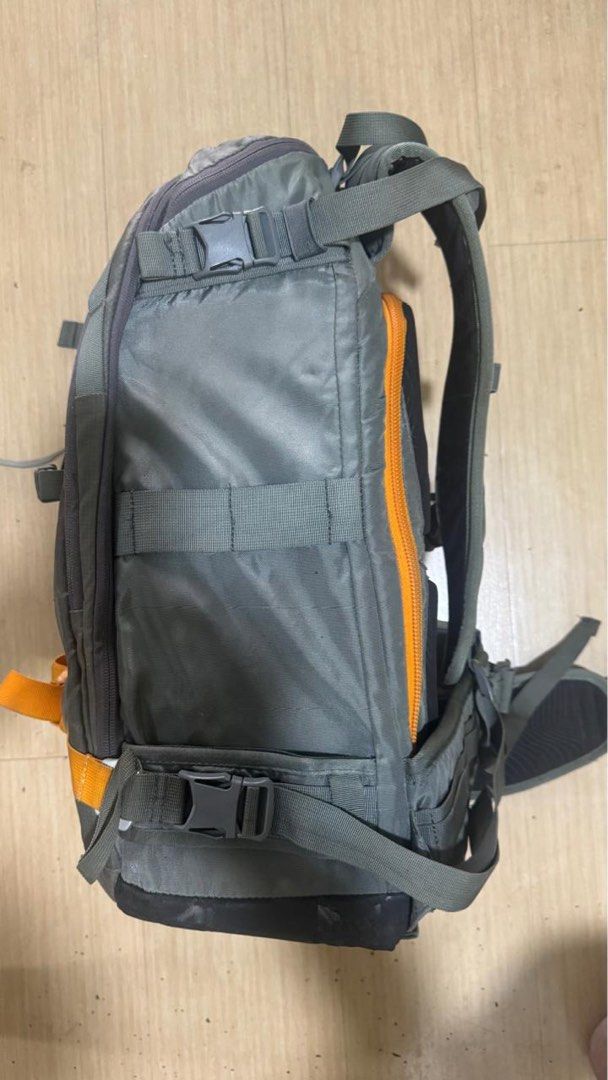 Lowepro Whistler BP 350 AW (Category: Camera Bags & Carriers) located in Mandaluyong City. Submitted by balowee (Listing ID 1452352768, Image 3). Description: - Grey Lowepro backpack - Orange zippers and straps - Multiple internal and external pockets/compartments - Adjustable shoulder straps - Waist strap for added support - Ideal for hiking and travel - Shows some dust and marks from use - Zippers are in good working condition.