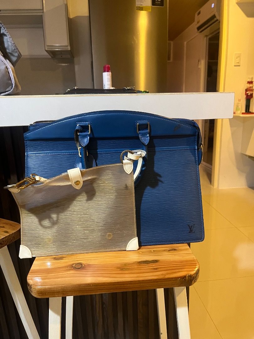 lv Ebi pochette and riviera (Category: Luxury Bags & Wallets) located in Manila. Submitted by dmaker_closet (Listing ID 1452469968, Image 1). Description: - Authentic Louis Vuitton Epi Pochette Accessoires and riviera - Classic blue Epi leather - Includes clear PVC pouch - Zipper closure - Perfect for carrying essentials.