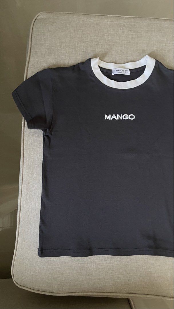 Mango Charcoal T-shirt with White Collar (Category: Shirts) located in Angat. Submitted by eltiff (Listing ID 1452437746, Image 2). Description: - Worn once only - Fits up to bust size 34 - Color: Charcoal - Style: Relaxed fit - Feature: White contrast collar - Detail: Simple logo on the front - Sleeves: Short - Style: Casual wear - Versatile: Easy to pair with jeans or shorts.