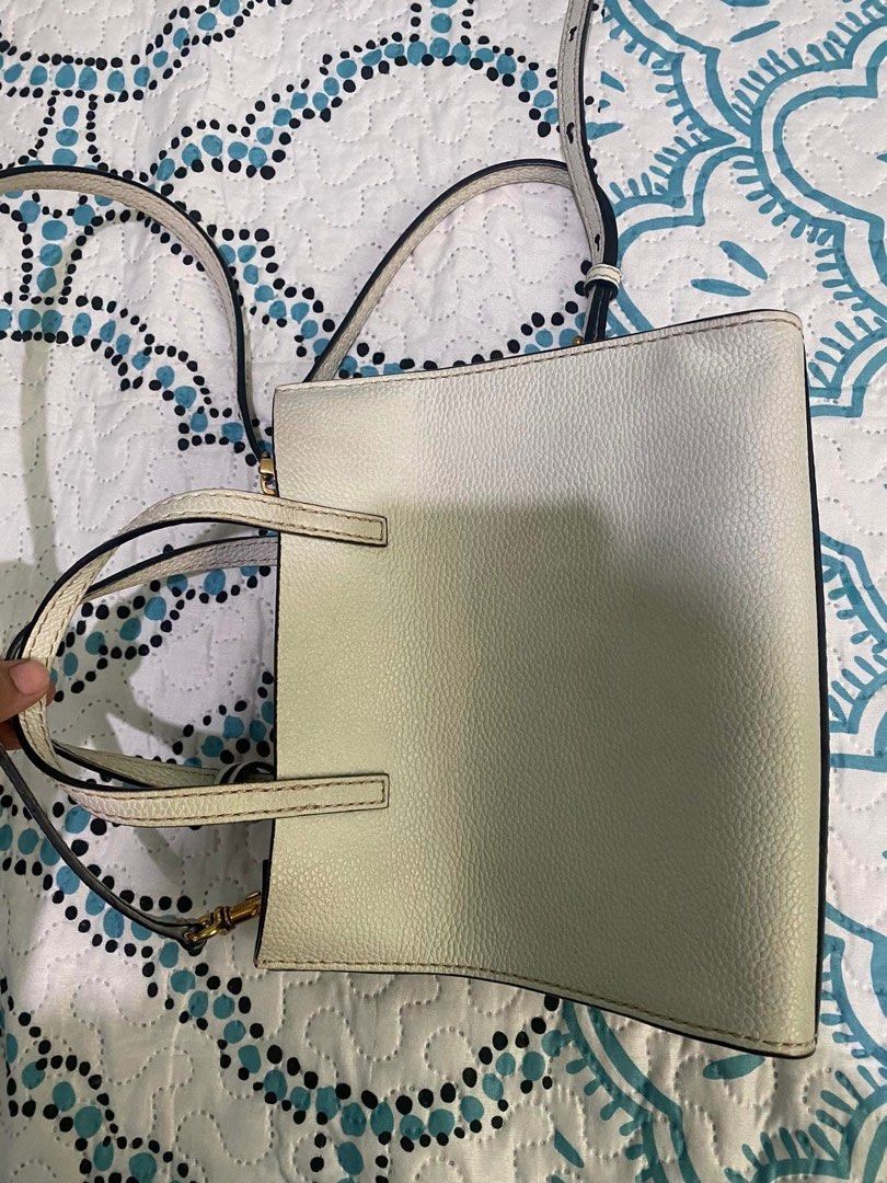 Marc Jacobs Leather Tote Bag (Category: Luxury Bags & Wallets) located in Bulacan. Submitted by paujps2012 (Listing ID 1452336891, Image 1). Description: - Authentic Marc Jacobs White Leather Tote Bag - Versatile: Top handles and detachable crossbody strap - Elegant Gold Hardware Details - Secure Interior Zip Pocket - Chic Front Lock Accent - Ample Space for Daily Essentials.