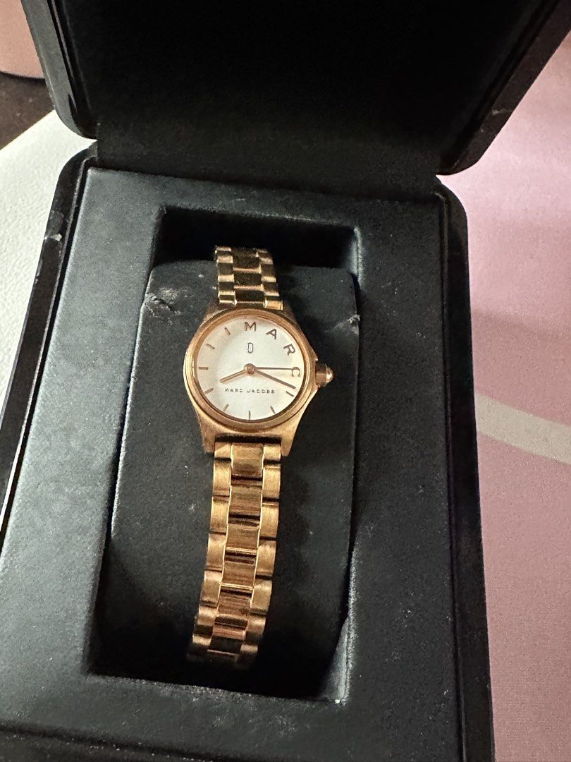 Marc Jacobs Rose Gold Watch with Box (Category: Women's Watches) located in Dasmarinas. Submitted by maecybee (Listing ID 1452374394, Image 1). Description: - Authentic Rose Gold Marc Jacobs Watch - Includes Original Box and Booklet - Classic White Face Design - Elegant Bracelet Style Strap - Versatile for Everyday or Dressy Occasions.