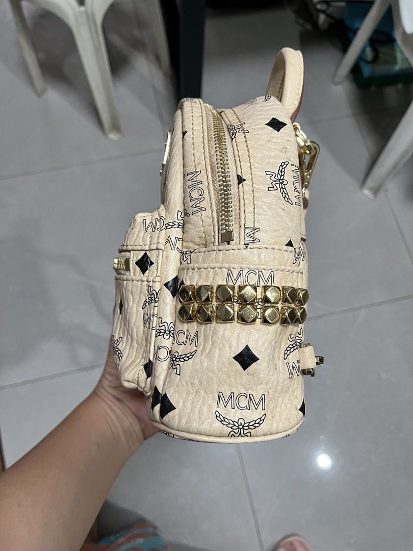 MCM Visetos Mini Backpack Beige (Category: Luxury Bags & Wallets) located in Cebu City. Submitted by nbetcuban007trendyfinds (Listing ID 1452350547, Image 2). Description: - Authentic MCM Mini Backpack - Classic Beige Visetos Print - Gold Hardware Details - Adjustable Straps - Compact Size - Ideal for Essentials - Zippers Function Smoothly - Turnable screw, like new -Last 2 pics sample only on how to wear.