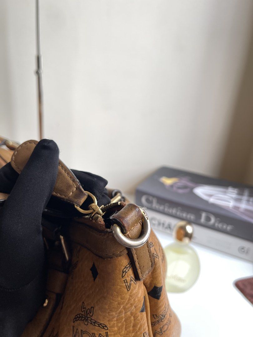 MCM Visetos Shoulder Bag Cognac Large (Category: Luxury Bags & Wallets) located in Quezon City. Submitted by vintagemuseco.ph (Listing ID 1410211451, Image 3). Description: EMCEM Visetos Tote Bag Cognac 👜 ✨ Original - Turnable Screw! ✨ Sign of used (7.5/10) ✨ Korea Sourced - White Tag ✨ Issue: discoloration on leather trim, rubs on corners, missing sling, pen marks inside 🏷️ P1,890 Message us or 𝙈𝙄𝙉𝙀 comment to claim. First to confirm gets 