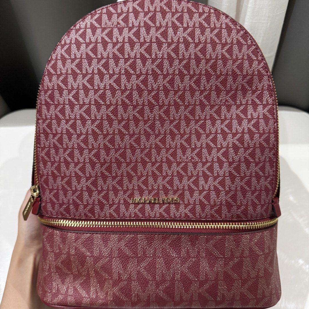 Michael Kors Rhea Medium Signature Logo Backpack (Category: Backpacks) located in Carmona. Submitted by g.declutter (Listing ID 1452433801, Image 2). Description: - Brand new with tag - Original from Canada - 10.5” W X 12.75” H X 5” D - Handle drop: 1.5” - Adjustable straps: 9”-13.25” - Price is still negiotable - RFS: Unused Location: Carmona, Cavite Mode of Payment: BPI (via QR) or Maribank Mode of Delivery: J&T or Lalamove (COD delivery fee).