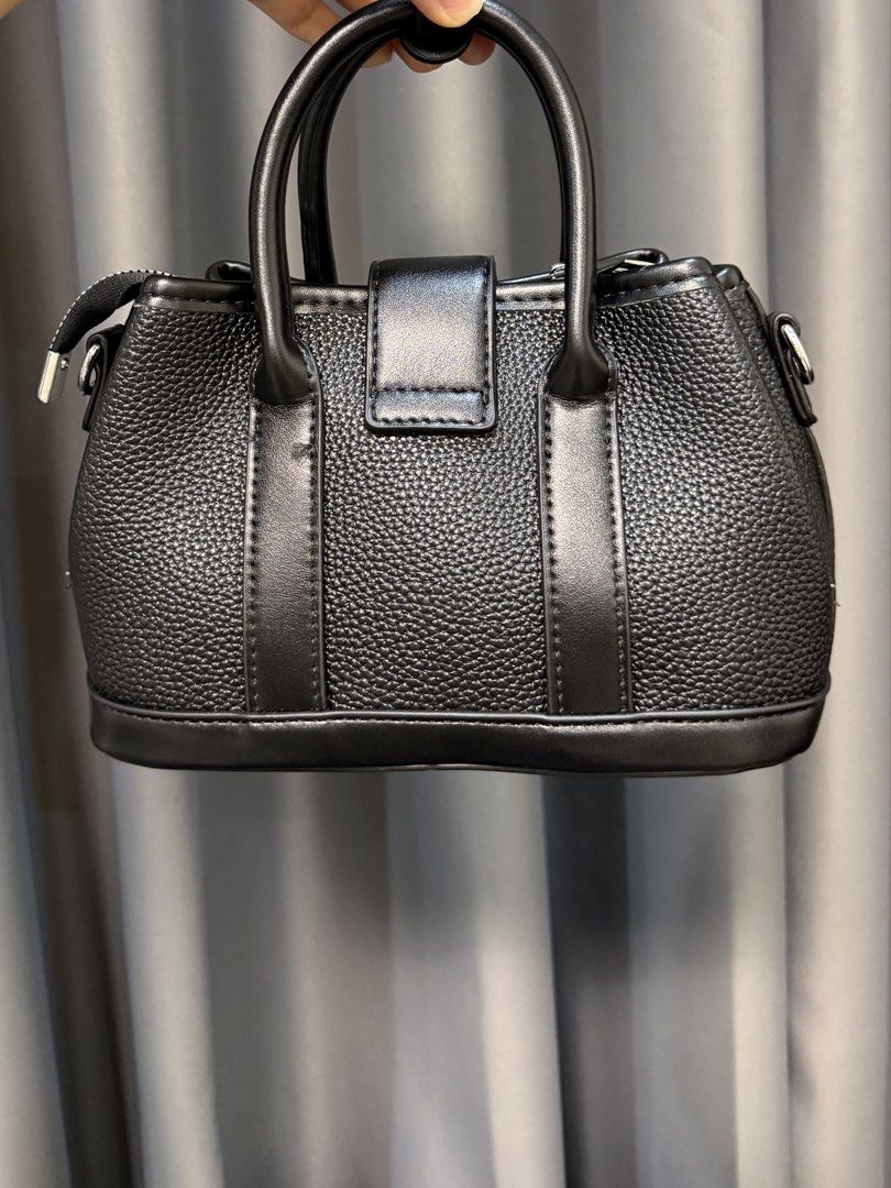 Mini Black Textured Top Handle Bag (Category: Luxury Bags & Wallets) located in Manila. Submitted by withluvbee (Listing ID 1452332330, Image 2). Description: - Secure clasp closure at the front - Top handles for carrying - Detachable strap for shoulder or crossbody wear - Zippered main compartment - Interior zippered pocket - Great for daily use, attending occasions .