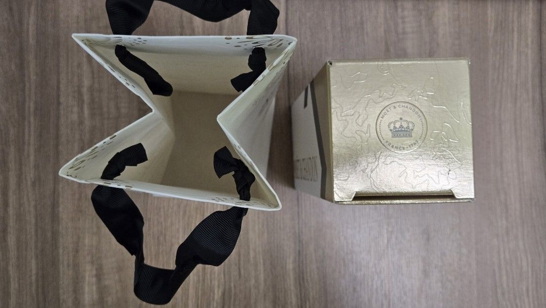 Moet&Chandon Gift Packaging (Category: Art & Prints) located in Kuala Lumpur. Submitted by paulinecassieopeia (Listing ID 1452497708, Image 3). Description: Moet&Chandon champagne gift packaging that's suitable to complete your gifting set, inclusive of champagne box & paper bag and fits 750ml champagne nicely Condition as per shown in pics above .