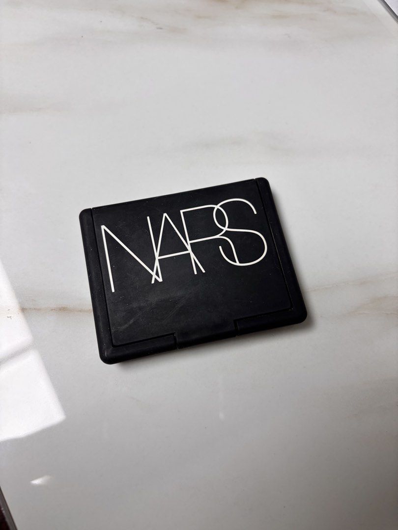 NARS Orgasm X Blush (Category: Makeup) located in Leyte. Submitted by modernpersephone (Listing ID 1452424796, Image 2). Description: - NARS Blush in shade Orgasm X - Beautiful peachy pink with subtle shimmer - Compact includes a mirror - Perfect for adding a pop of color to cheeks - Selling because of having too many blushes - Still has plenty of product remaining Used a few times lang. This is full size. .