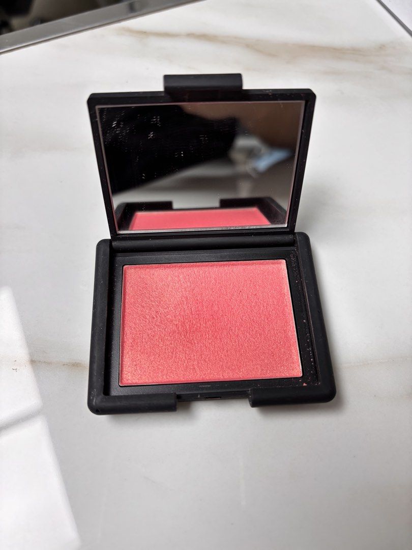 NARS Orgasm X Blush (Category: Makeup) located in Leyte. Submitted by modernpersephone (Listing ID 1452424796, Image 1). Description: - NARS Blush in shade Orgasm X - Beautiful peachy pink with subtle shimmer - Compact includes a mirror - Perfect for adding a pop of color to cheeks - Selling because of having too many blushes - Still has plenty of product remaining Used a few times lang. This is full size. .