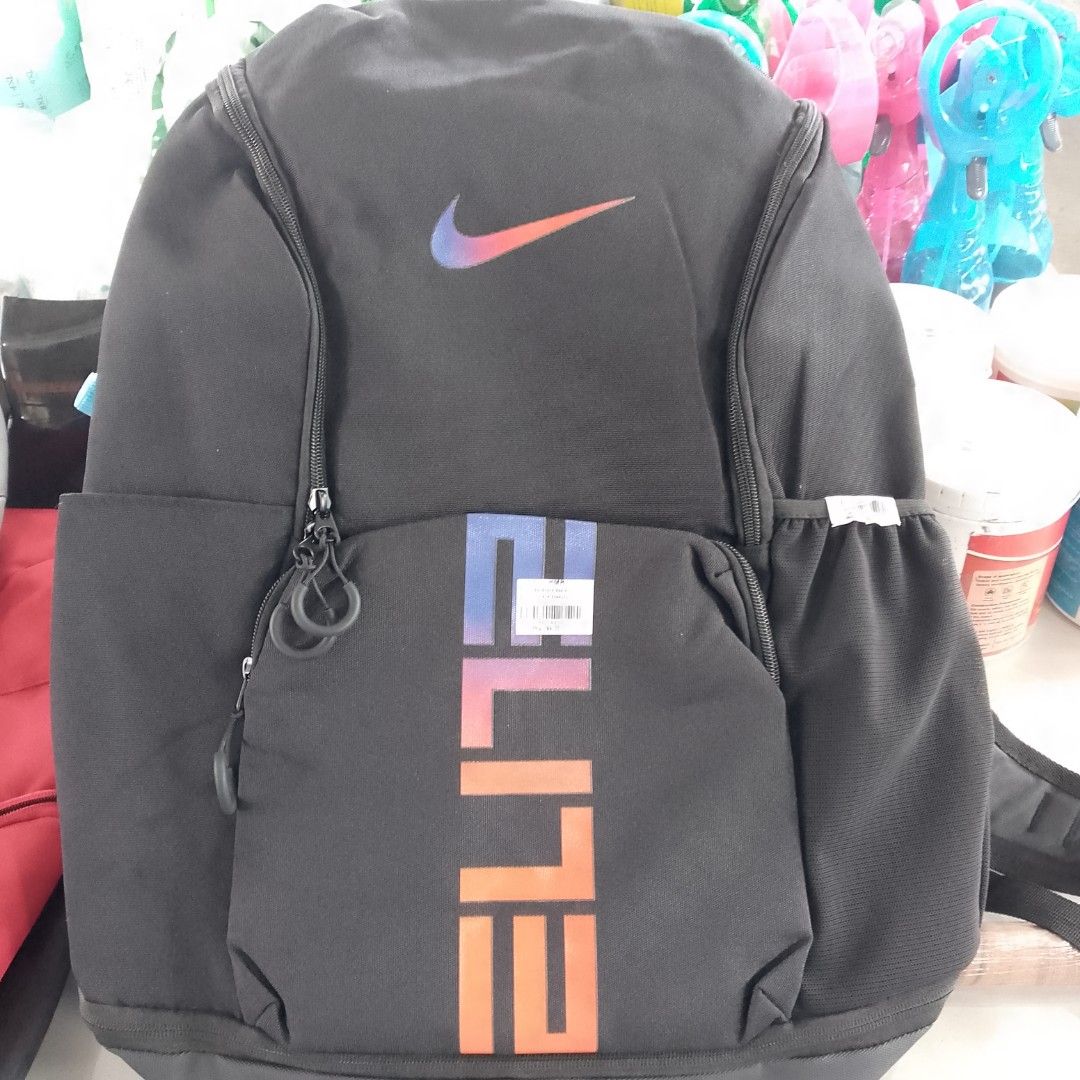 Nike Elite Backpack Black (Category: Backpacks) located in Manila. Submitted by cleverwolf.07545a (Listing ID 1452330810, Image 1). Description: - Authentic Nike Elite backpack - Features iconic Nike swoosh logo with a stylish gradient color - 'ELITE' text on the front pocket also in a gradient design - Convenient side pockets for water bottles - Ideal for school, gym, or sports activities.