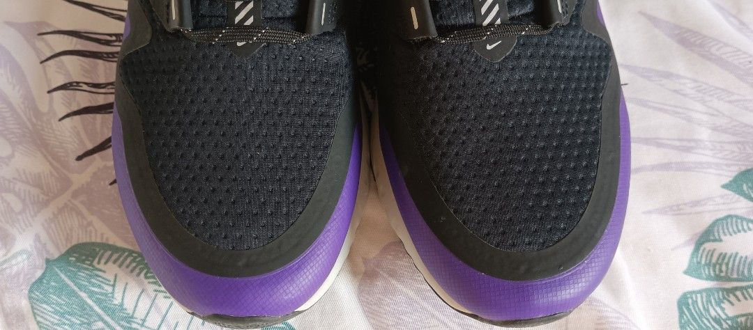Nike Odyssey React 2 Shield Men's Shoes (Category: Sneakers) located in Manila. Submitted by shop_no.15 (Listing ID 1452410393, Image 2). Description: - Nike Odyssey React 2 Shield - Color: Black and Purple - Water-repellent material for wet conditions - Reflective details for visibility - React cushioning for superior comfort - Ideal for running/training - Size US9.5.