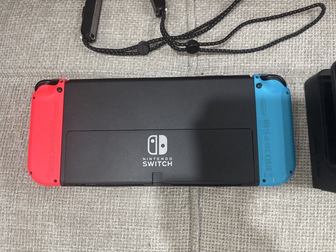 NINTENDO SWITCH OLED (Category: Other Gadgets) located in Quezon City. Submitted by royalbird.47169f (Listing ID 1452453646, Image 3). Description: FOR SALE: Nintendo Switch OLED Inclusions: • Nintendo Switch OLED Console • Dock • Original Charger • HDMI Cable • 2 pairs of Joy-Cont • Tempered Glass installed • Joy-Con Grip +1k - overcooked (All you can eat) Meet up: Malolos Lalamove RFS: Wala ng time maglaro..