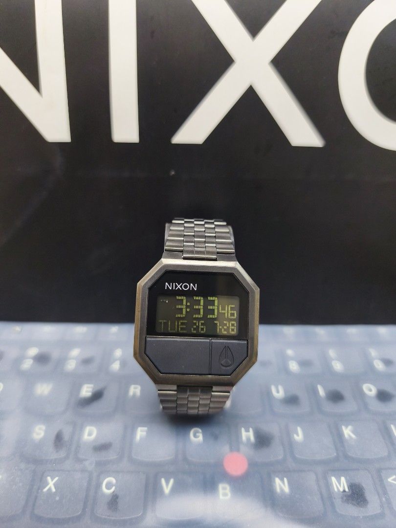 Nixon Digital Watch (Category: Watches) located in Ampang. Submitted by y2jwatch (Listing ID 1452391941, Image 1). Description: - Classic Nixon digital watch - Features a durable metal strap - Displays both time and date - Includes original Nixon box - Ideal for everyday use.