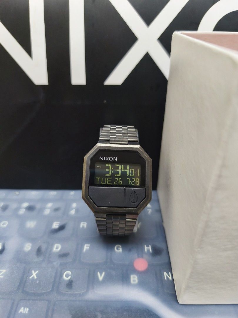 Nixon Digital Watch (Category: Watches) located in Ampang. Submitted by y2jwatch (Listing ID 1452391941, Image 3). Description: - Classic Nixon digital watch - Features a durable metal strap - Displays both time and date - Includes original Nixon box - Ideal for everyday use.