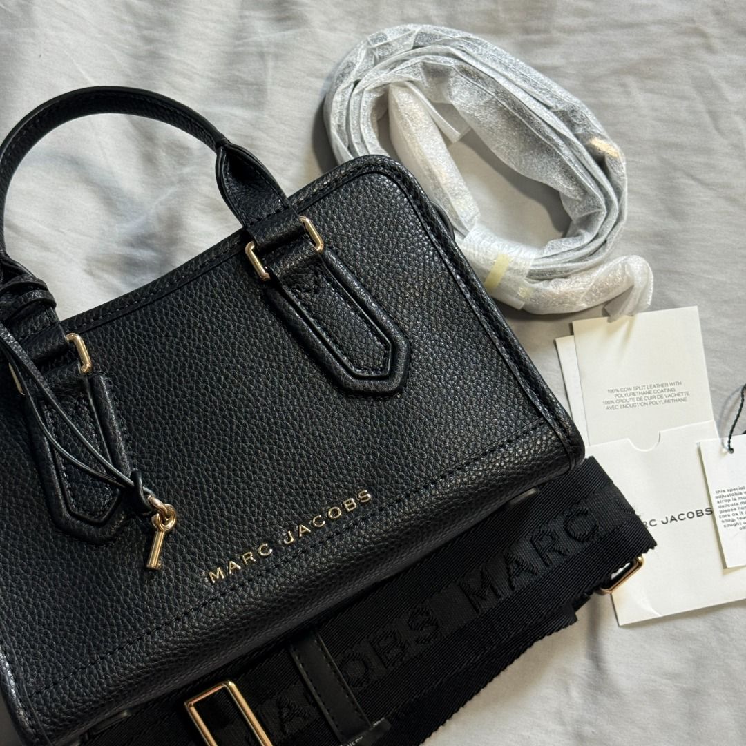 NWT Marc Jacobs Drifter Satchel Bag (Category: Luxury Bags & Wallets) located in Manila. Submitted by santatricia (Listing ID 1452486796, Image 1). Description: NWT Marc Jacobs Drifter Satchel Bag In Black/Gold hardware H747L01RE22 FREE Marc Jacobs Logo Strap nego.