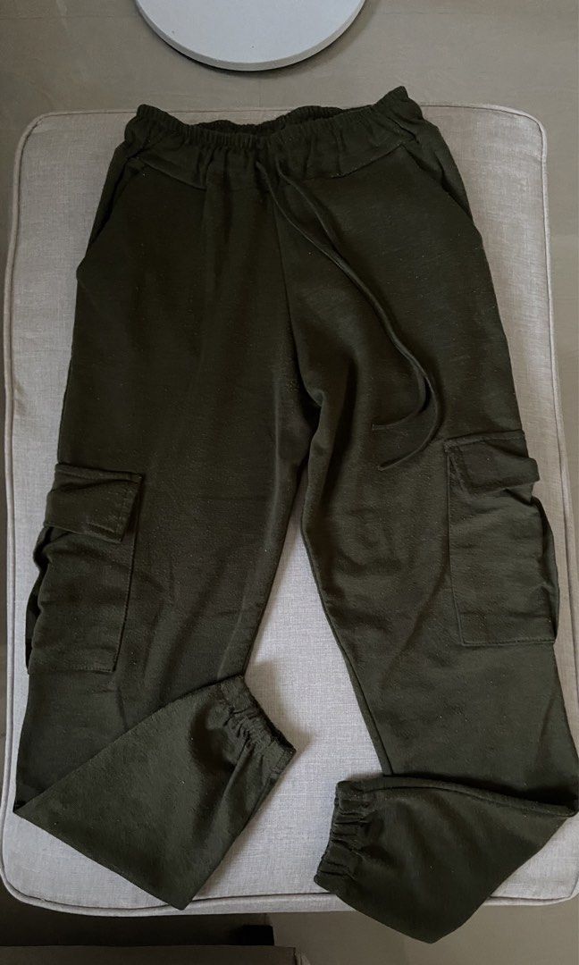 Olive Green Cargo Jogger Pants with Drawstring Waist (Category: Other Bottoms) located in Angat. Submitted by eltiff (Listing ID 1452426362, Image 1). Description: - Fits up to waist size 30 - Comfy army green cargo pants - Jogger style with elasticated cuffs - Drawstring waist for adjustable fit - Two side pockets - Two cargo pockets on legs.