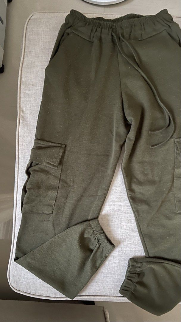 Olive Green Cargo Jogger Pants with Drawstring Waist (Category: Other Bottoms) located in Angat. Submitted by eltiff (Listing ID 1452426362, Image 3). Description: - Fits up to waist size 30 - Comfy army green cargo pants - Jogger style with elasticated cuffs - Drawstring waist for adjustable fit - Two side pockets - Two cargo pockets on legs.