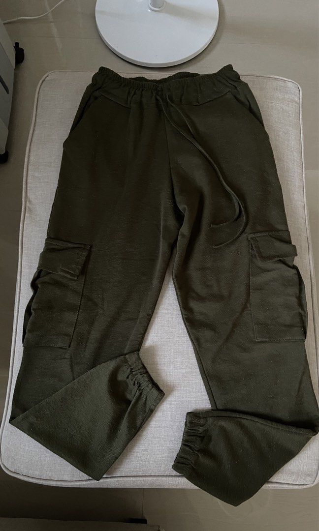 Olive Green Cargo Jogger Pants with Drawstring Waist (Category: Other Bottoms) located in Angat. Submitted by eltiff (Listing ID 1452426362, Image 2). Description: - Fits up to waist size 30 - Comfy army green cargo pants - Jogger style with elasticated cuffs - Drawstring waist for adjustable fit - Two side pockets - Two cargo pockets on legs.