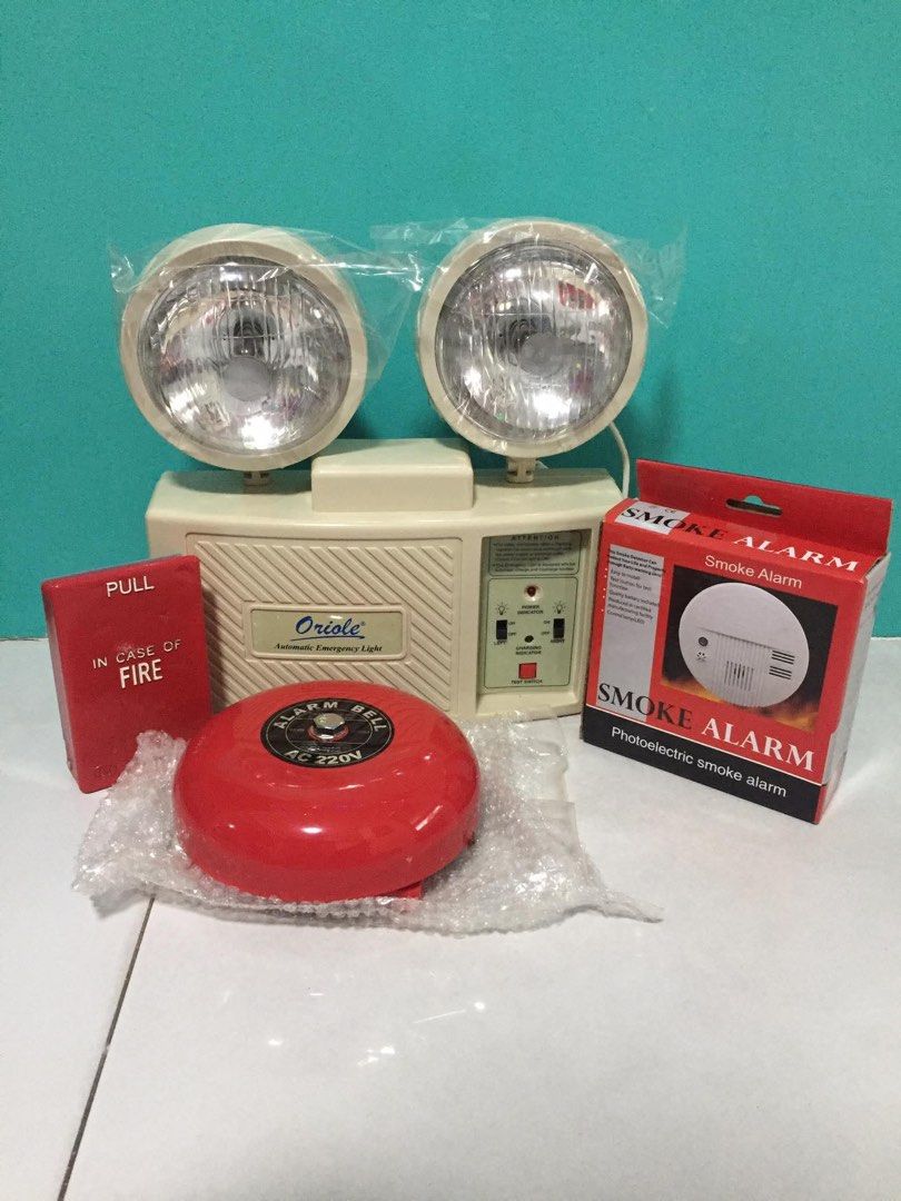 Oriole Emergency Light, Smoke Alarm, Fire Bell, Fire Box (Category: Lighting) located in Pasay City. Submitted by mendozaann25070 (Listing ID 1452394767, Image 1). Description: - Oriole Automatic Emergency Light with 2 Lamps - Red Alarm Bell (AC 220V) - Red 'In Case of Fire' Pull Box - Photoelectric Smoke Alarm - All items in original packaging or protected.