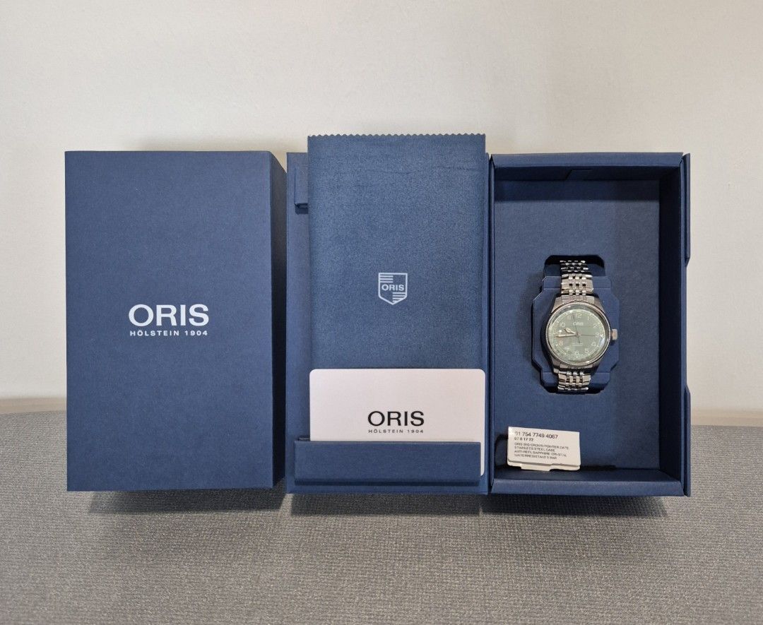 Oris Big Crown Pointer Date (Category: Watches) located in Singapore. Submitted by flip.table (Listing ID 1452507494, Image 2). Description: - Oris Big Crown Pointer Date Watch - Stunning Green Dial - Stainless Steel Bracelet - Full Set: Box & Warranty Card Included - Warranty Valid Until: 08/12/2027 - Condition: BNIB Get this watch, it's one of the cheapest new BCPDs out there and it'll be your daily beater watch. .