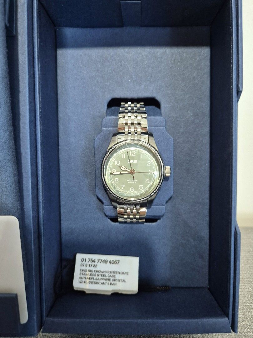 Oris Big Crown Pointer Date (Category: Watches) located in Singapore. Submitted by flip.table (Listing ID 1452507494, Image 3). Description: - Oris Big Crown Pointer Date Watch - Stunning Green Dial - Stainless Steel Bracelet - Full Set: Box & Warranty Card Included - Warranty Valid Until: 08/12/2027 - Condition: BNIB Get this watch, it's one of the cheapest new BCPDs out there and it'll be your daily beater watch. .