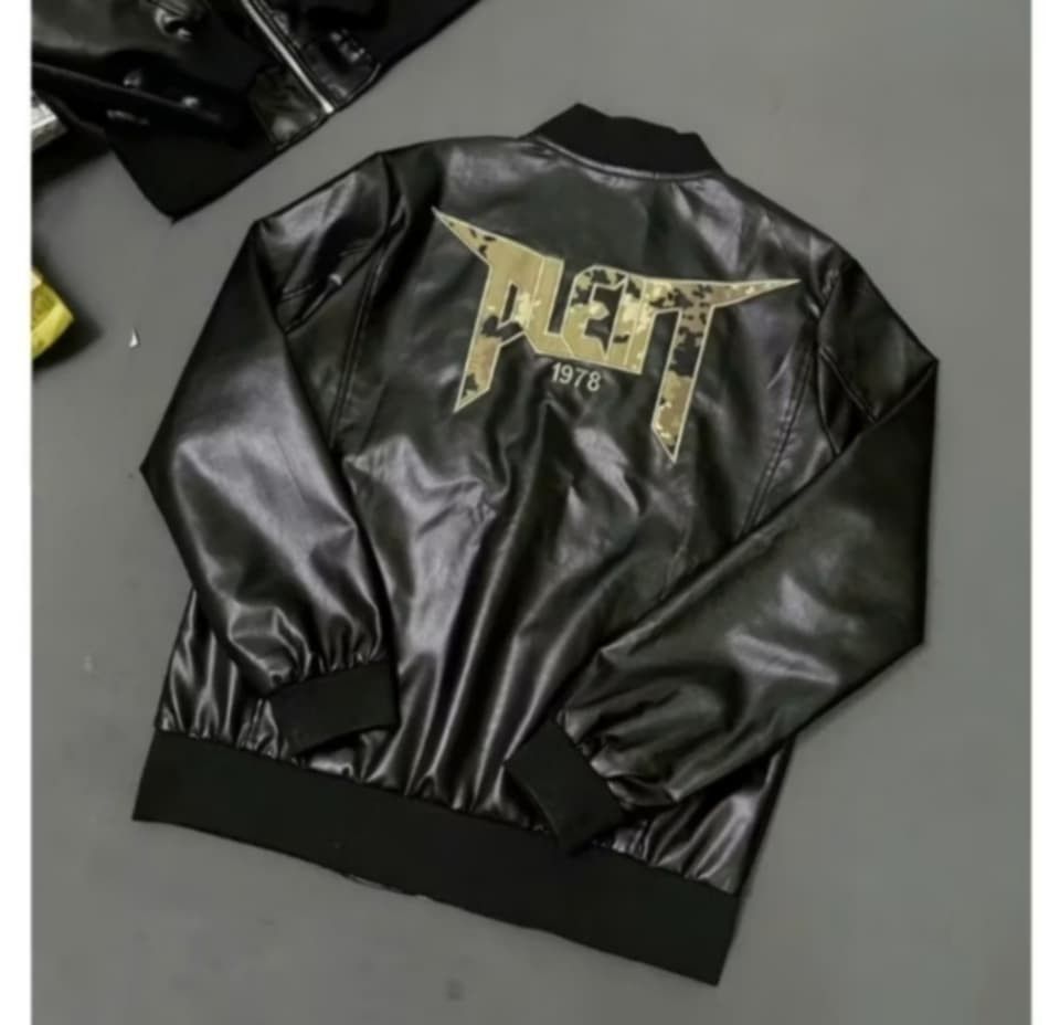 Philipp Plein Black Faux Leather Bomber Jacket (Category: Coats, Jackets and Outerwear) located in Alaminos. Submitted by osaj55756 (Listing ID 1452329150, Image 2). Description: - Black faux leather bomber jacket size large - Philipp Plein logo on chest - Large 'PLEIN 1978' graphic print on back - Zipper closure - Zippered front pockets - Ribbed collar, cuffs, and hem - Sharp, stylish look.