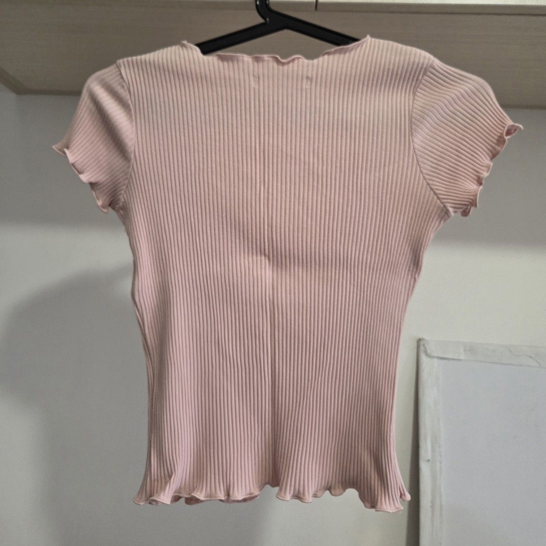 Pink Ribbed Fitted Lettuce-Hem Shirt (Category: Blouses) located in Manila. Submitted by weirdlysa (Listing ID 1452375812, Image 2). Description: - ribbed fitted shirt - cute baby pink color - best fits women's size S-M - stretchy material, with body-hugging fit - lettuce hem on neckline and sleeves.