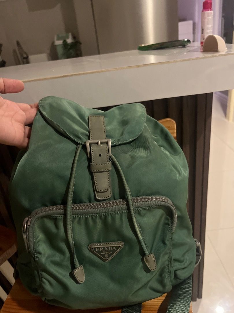 Prada Nylon Backpack & Shoulder Bag - Green & Grey (Category: Luxury Bags & Wallets) located in Manila. Submitted by dmaker_closet (Listing ID 1452468963, Image 2). Description: - Authentic Prada nylon bag set - Includes: 1 green backpack with drawstring closure and front pocket, 1 grey shoulder bag - Lightweight and practical for daily use - Ideal for travel or everyday errands.