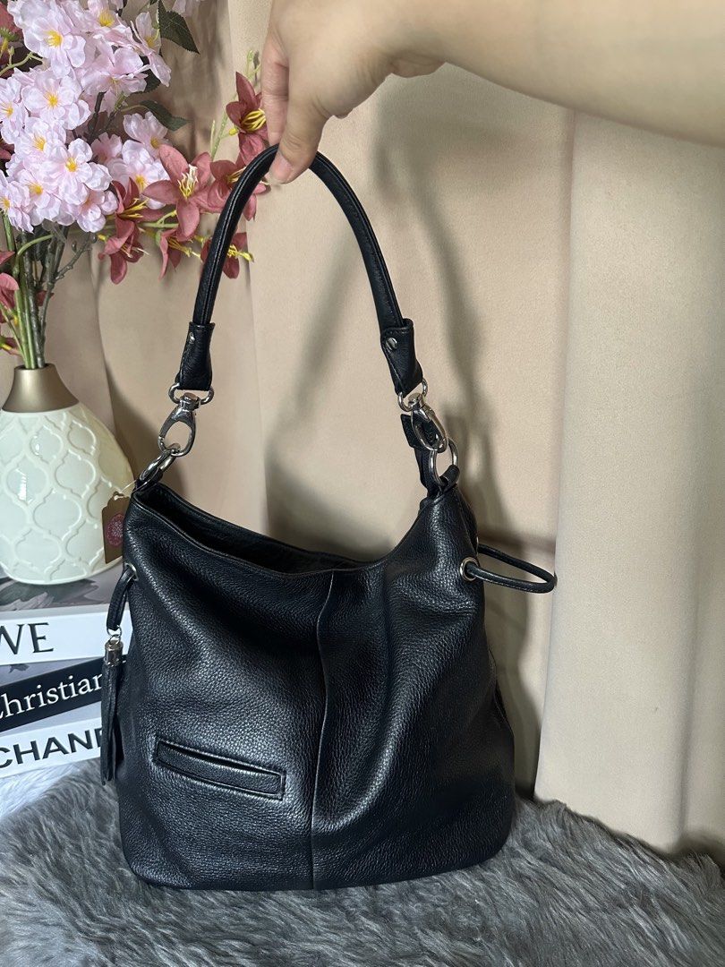 Rangrang hobo black bag (Category: Shoulder Bags) located in Rizal. Submitted by stuffbuyph (Listing ID 1452352136, Image 3). Description: - Stylish black pebbled leather hobo bag - Convenient zippered pocket on the back - Handy smaller zippered pocket on the front - Eye-catching tassel detail on one side - Secure interior zippered compartment - Elegant silver hardware accents - Comfortable shoulder strap for easy carrying.